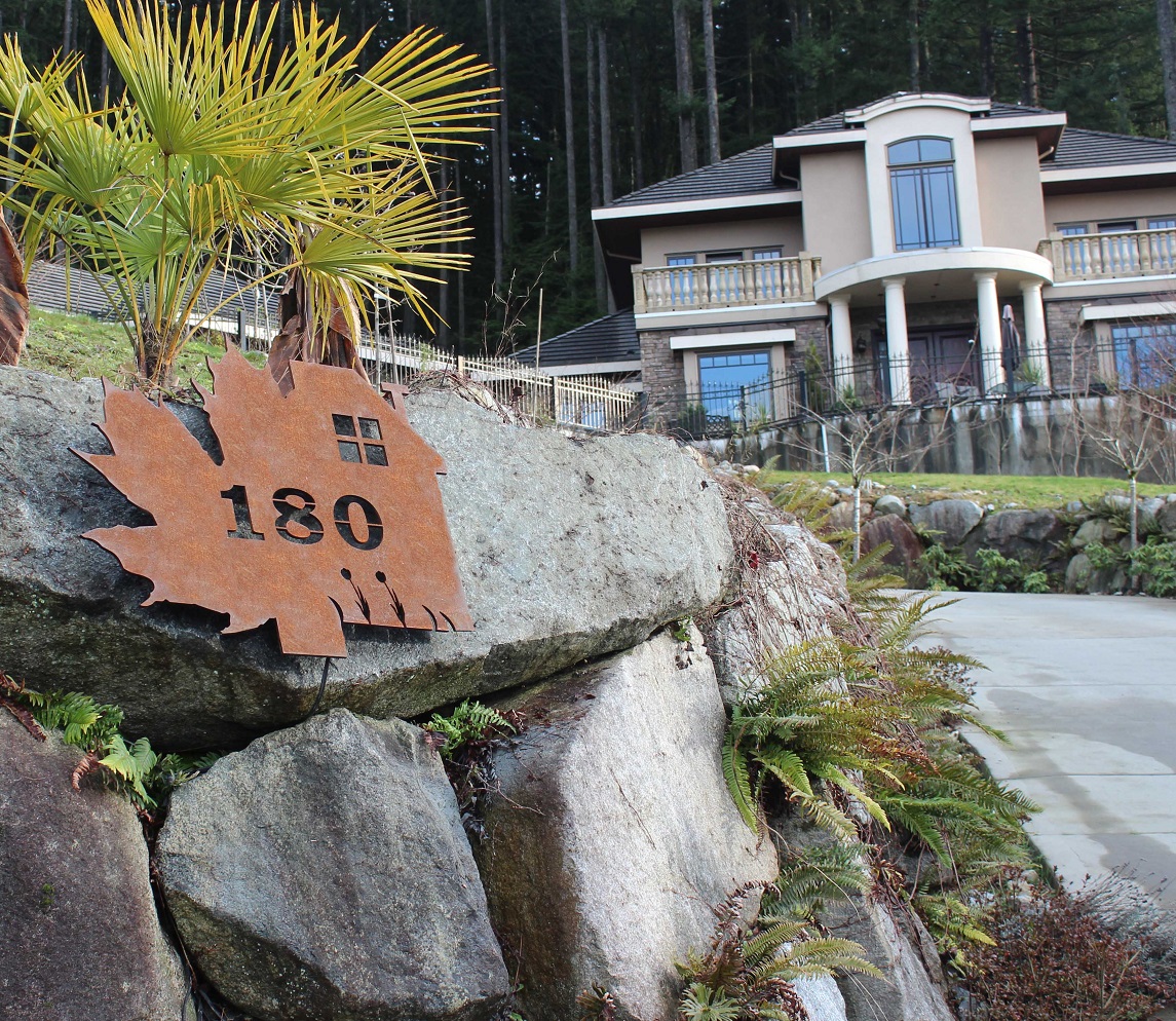 Rusted metal address sign made of iron